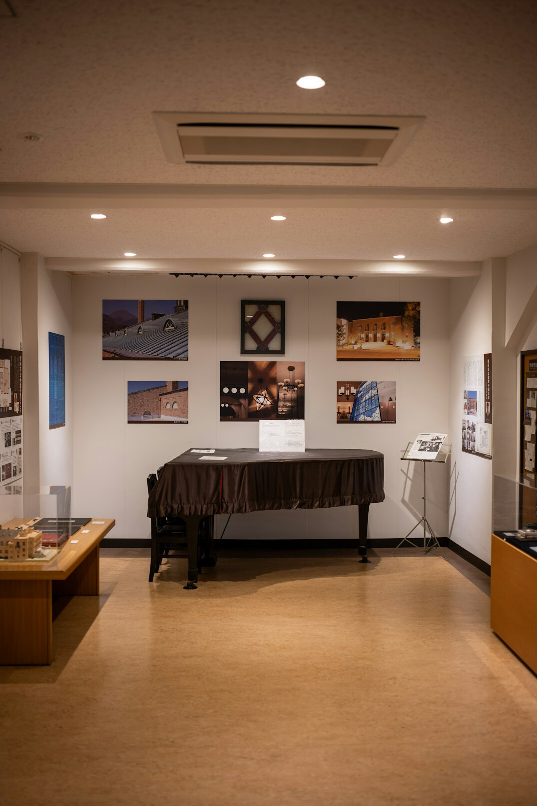 Hands operating a video mixing desk in a gallery